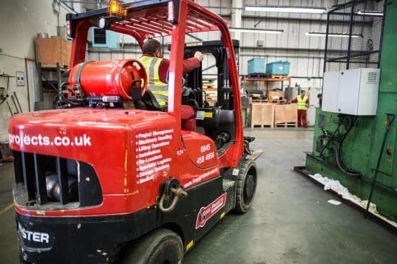 Forklift driver in warehouse