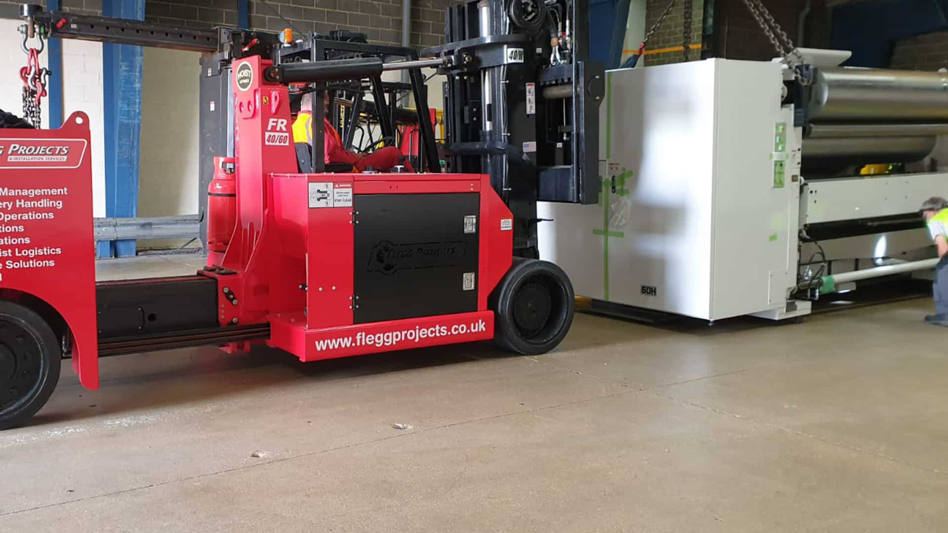 Lifting white Machinery in a factory