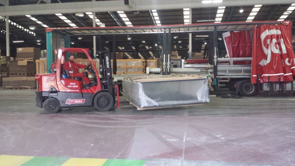 forklift moving a large crate