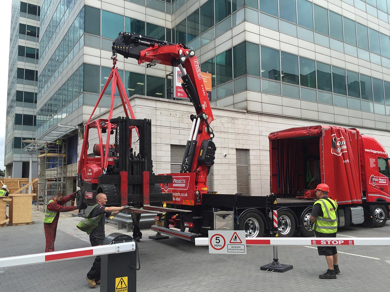 Forklift being craned from a lorry