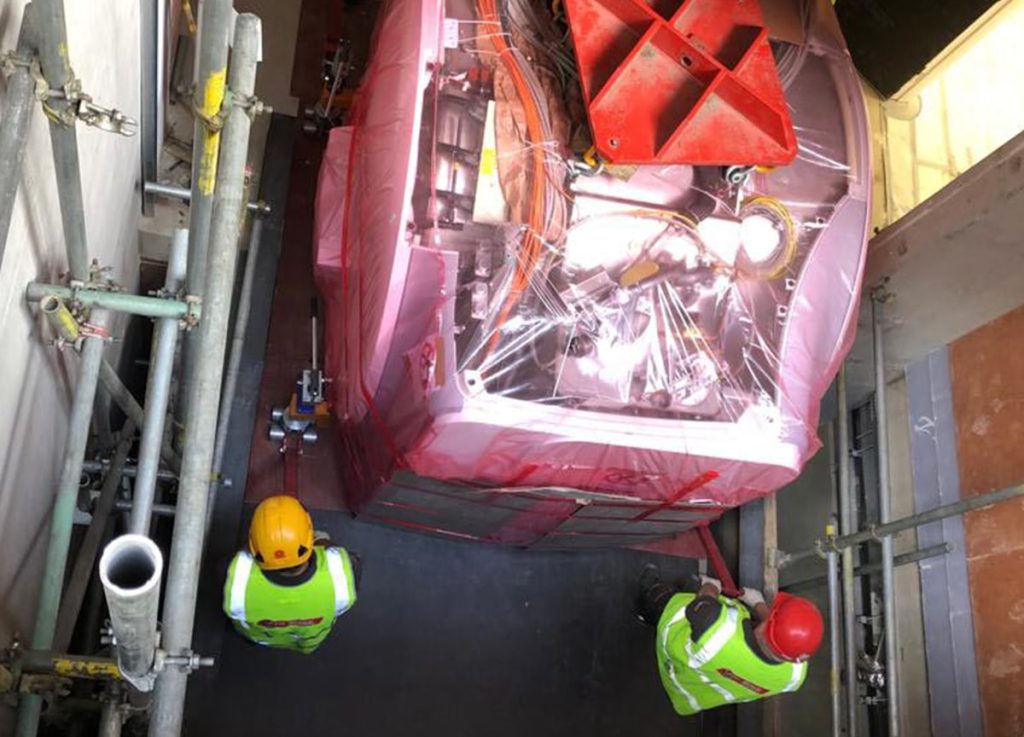 lifting medical machinery out of a roof